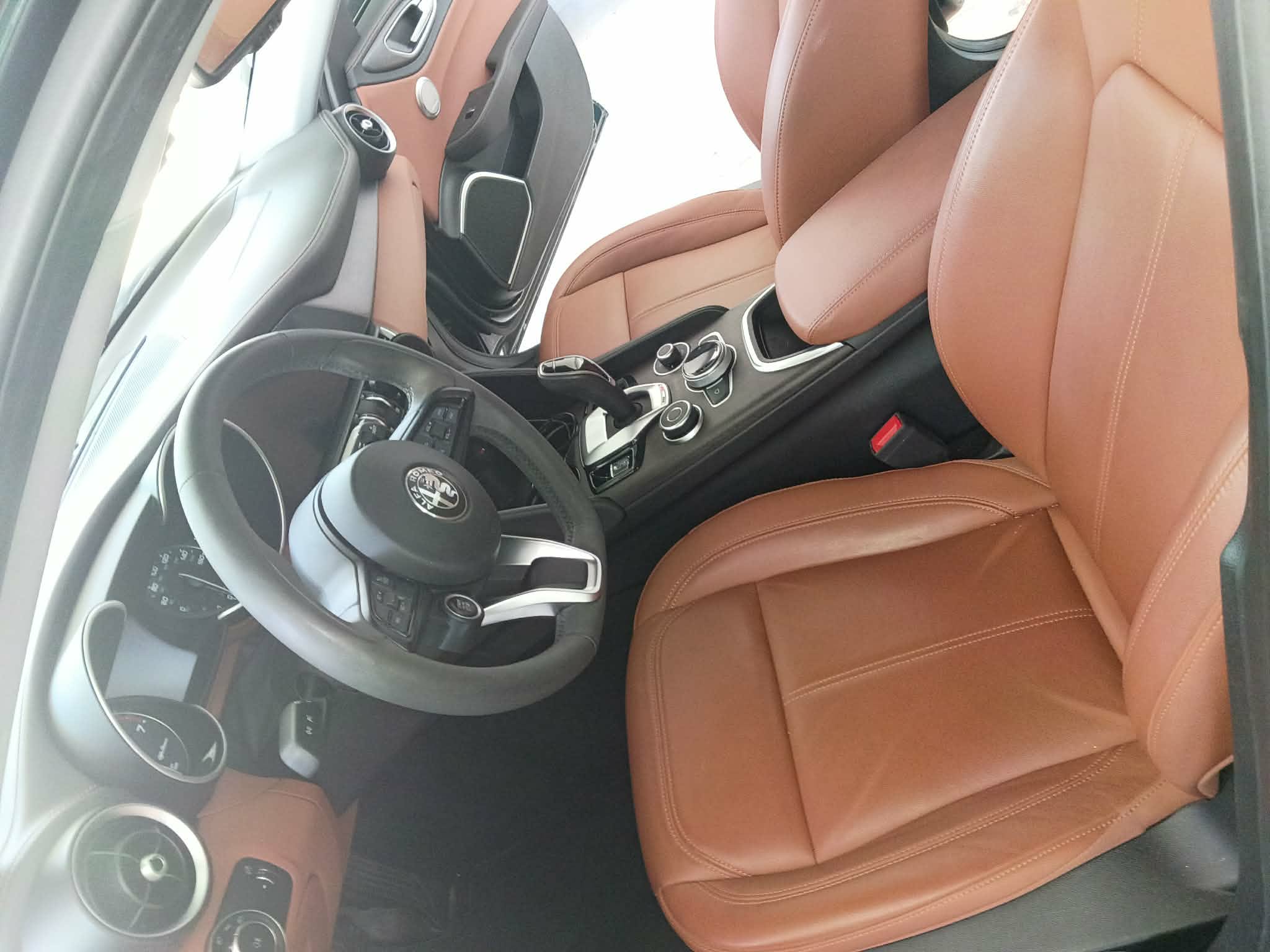 Detailed leather interior and center console of a vehicle